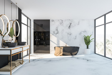 Black and white bathroom interior, tub and sink