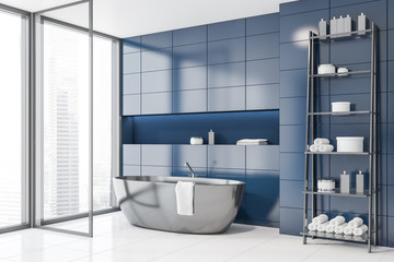 Blue tile bathroom corner with tub