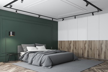 Green, wooden and white master bedroom corner