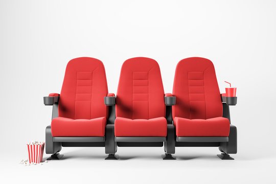 Three red cinema chairs on white background
