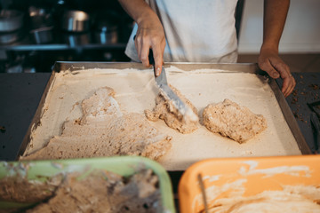 Professional confectioner working making and decorating delicious sweets.