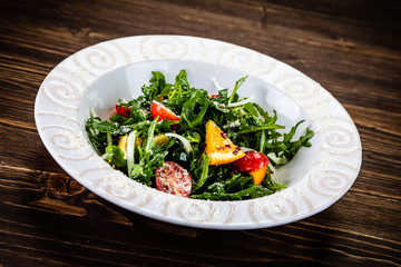 Greek salad on wooden background