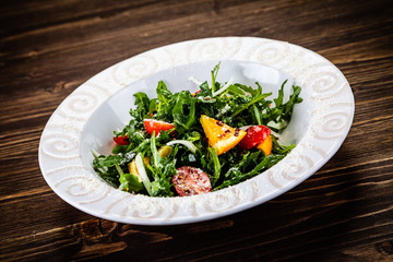 Greek salad on wooden background