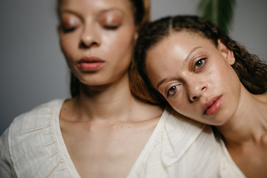 Close Up Of Twin Siblings At Home