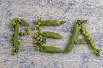 raw peas on a wooden table