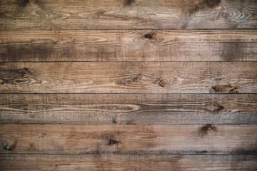 Old brown wood background made of dark natural wood in grunge style. The view from the top. Natural...