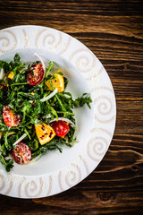 Greek salad on wooden background