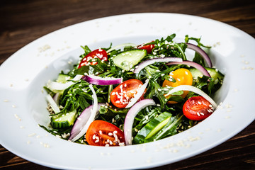 Greek salad on wooden background