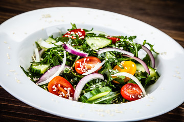 Greek salad on wooden background