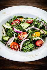 Greek salad on wooden background
