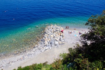 Fototapeta na wymiar Aerial view of the sea and rocky beach near cape Noli along Liguria coast, Italy 