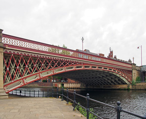 Naklejka premium crown point bridge crossing the river aire in leeds a single span fretted cast iron construction opened in 1842 taken from the riverside path