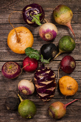 vegetables on a wooden background. Cauliflower, broccoli, radish, parsnip, leek, kohlrabi
