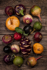 vegetables on a wooden background. Cauliflower, broccoli, radish, parsnip, leek, kohlrabi