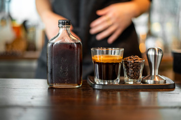 Black coffee in small shot .