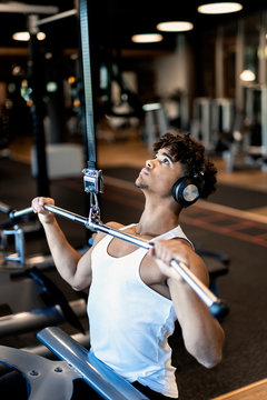 Young afro man training in the gym