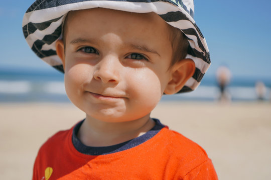 Portrait of Little kid playing at the seashore