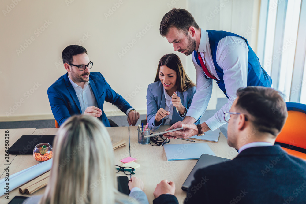 Wall mural  Group of young business people working together in creative office.