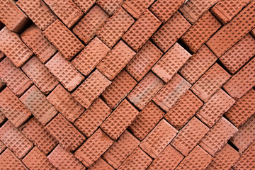 Material for the construction of a new building. New red clay bricks for masonry building walls.