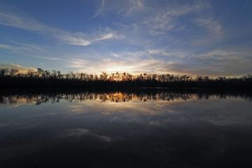 Sunset on Coot Bay Pond in Everglades National Park, Florida on a calm winter evening.