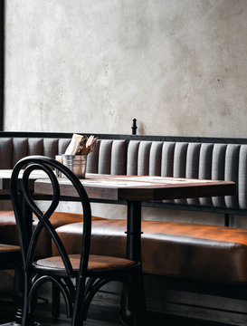 Dark colored interior of cafe with shabby wall