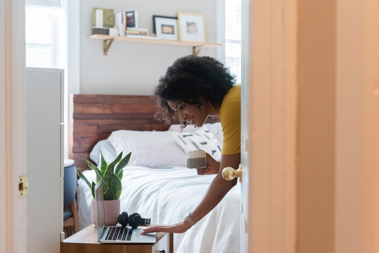 Woman checking her e-mail during morning routine