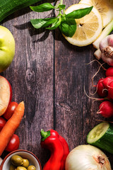 Top view of  the vegetables on the wooden background. Copy space