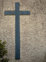 Catholic cross on a wall. Symbol of faith.
