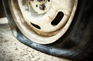 Flat tire. Punched wheel on a car. Close-up