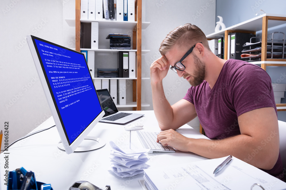 Poster Worried Man At Computer With System Failure On The Screen