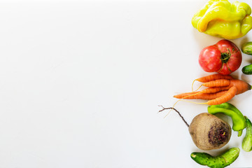 Ugly vegetables on a white background. Ugly food concept, flat lay.