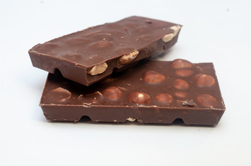 Chocolate with nuts isolated on white background
