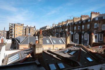 London, England - May 13, 2019: Cityscape panorama of traditional British brick houses .