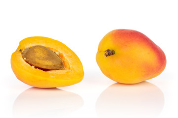 Group of one whole one half of fresh orange apricot with an apricot stone isolated on white background