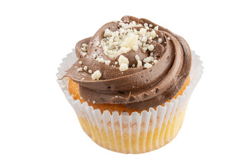 On a cupcake chocolate cream. All details in focus. Full depth of field.