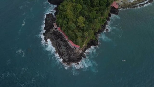 Aerial view of green cliff in edge of island