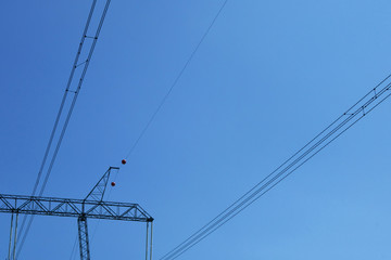 High voltage tower, sky background. Transmission line of electricity. Electric wire electric tower.