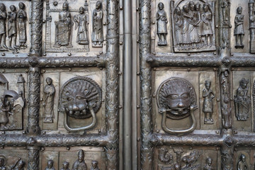 Ancient chasing on the fortress gate dedicated to biblical subjects