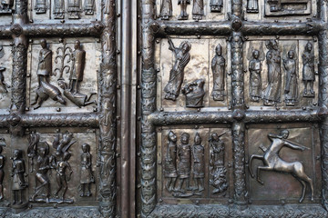 Ancient chasing on the fortress gate dedicated to biblical subjects