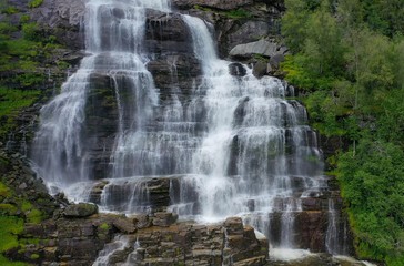 Naklejka premium Tvindefossen (also written Tvinnefossen; also called Trollafossen) is a waterfall near Voss, Norway. It is 12 km from Voss on the road to FlÃ¥m.