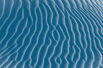 Sand texture background. Blue tint.