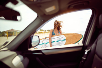 woman at the beach. Surfing. Summer Vacation..