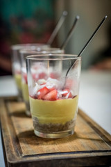 dessert in glass with strawberries and coconut scratch