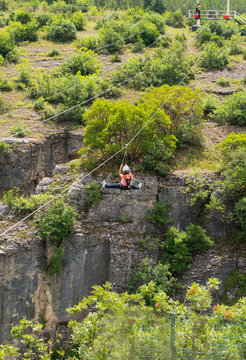 Tourist sliding on a zip line in Incekaya Canyon just near Kristal Cam Teras, Safranbolu Karabuk, Turkey