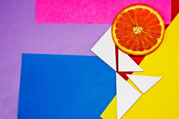Juicy orange slice on color backgrounds