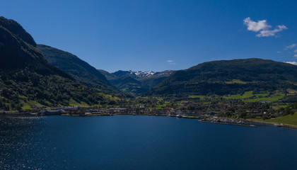 Naklejka na ściany i meble Vik, Norway - july, 2019: Vik port, Vik is a municipality in Sogn og Fjordane county. It is located on the southern shore of the Sognefjorden in the traditional district of Sogn. Aerial(drone) photo.