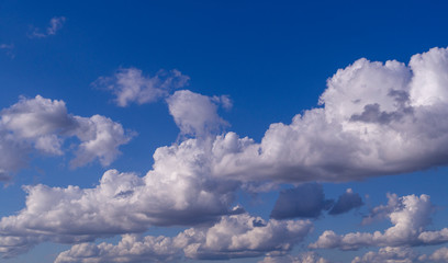 Fototapeta premium blue sky with white and gray clouds; cumulus. background; nature
