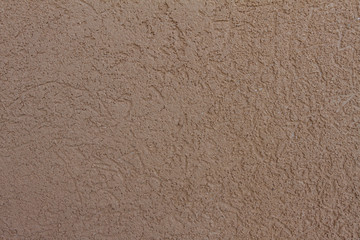 Background wall with concrete orange design. Concrete wall with a fine crumb. The texture of the concrete wall.