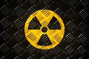 Radioactive (ionizing radiation) round yellow and black danger symbol painted on a massive steel...