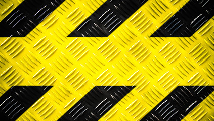 Warning sign yellow and black stripes painted on steel checker plate or diamond plate on floor...